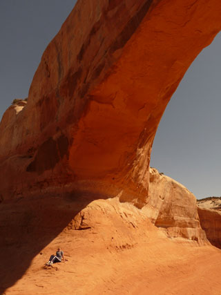 Rhonda sitting at Wilson Arch