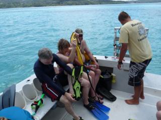 Guests get ready to snorkel and explore the coral reef