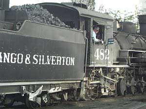 The #482 locomotive being readied by the conductor for another run, which dates to the early 1920s.