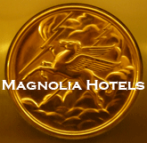 Original bronze emblems adorn the elevator doors at the Magnolia Hotel in Dallas