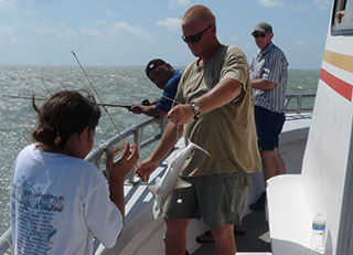 Too small to keep, a few sharks were caught, adding to the excitement during our trip.