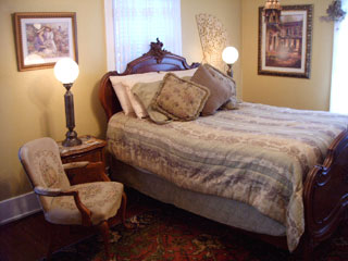 The Provence Room includes several antiques, with a heart shaped hot tub