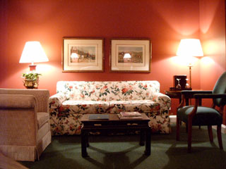 Our living room area of our guest room ter was tastefully appointed in rich crimson and forrest green colors