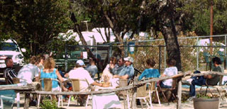 Enjoying the outdoors by the pool at the Jellystone Hill Country Park 