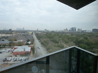 Enjoy a refreshing breeze and scenic views of downtown Houston and the Galleria from a private corner balcony