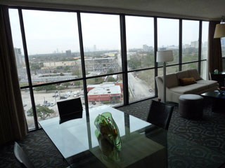 Floor-to-ceiling windows provide impressive views of Houston